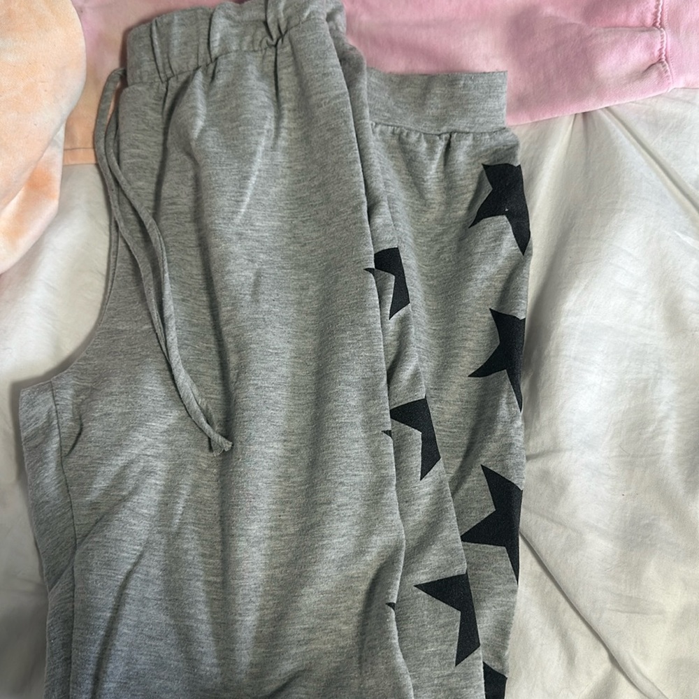 Sweatpants with stars down pant legs